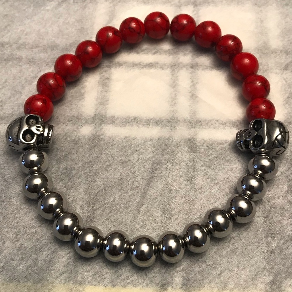 Silver and red bead bracelet with skulls